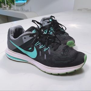 Nike teal and black tennis shoes.